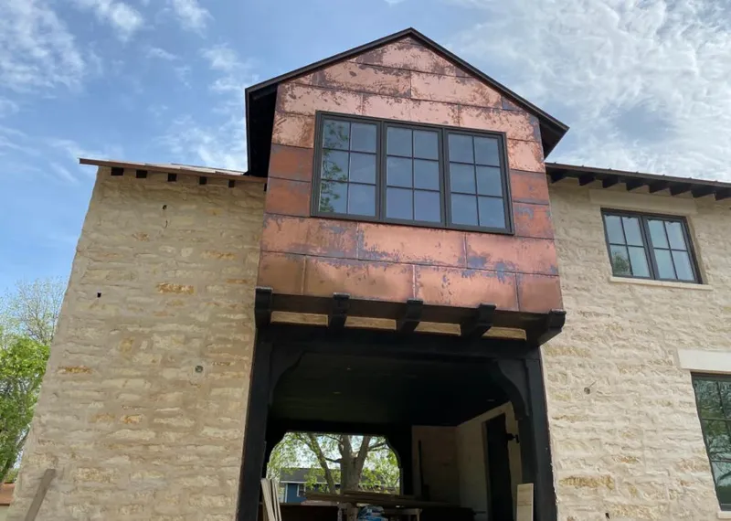 Copper metal panel facade on a stone building for Metal Roof Coating in Azle